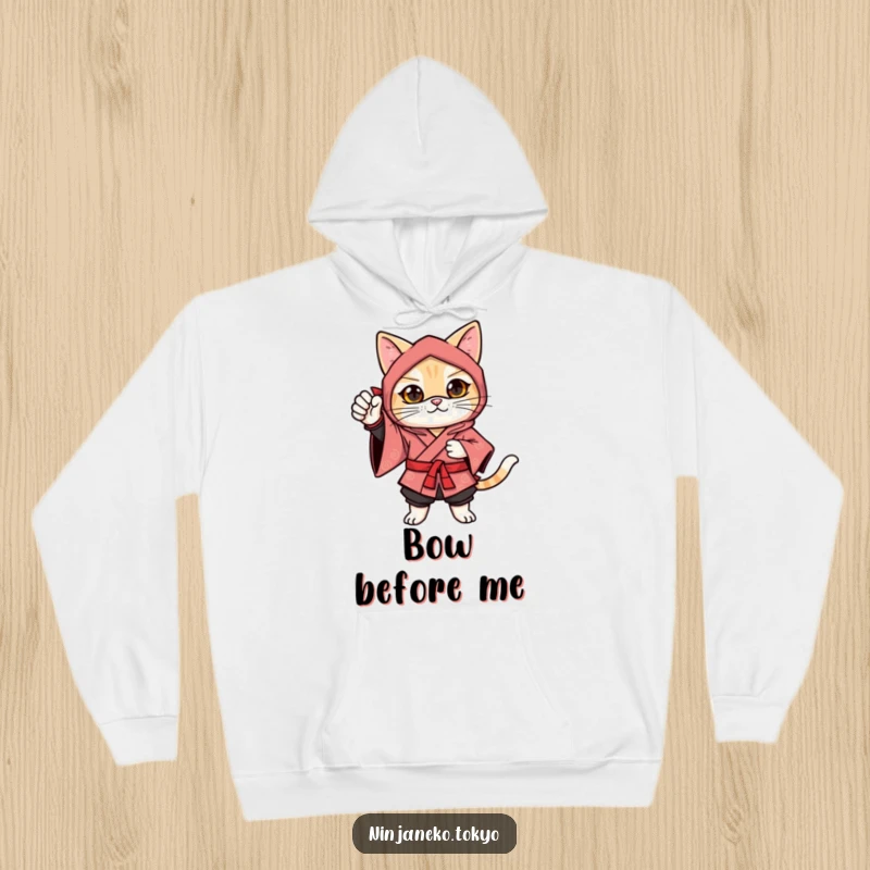 Funny ninja cat in a festive kimono in a confident pose with one paw raised, designed for comfort and festive fun on this hoodie.