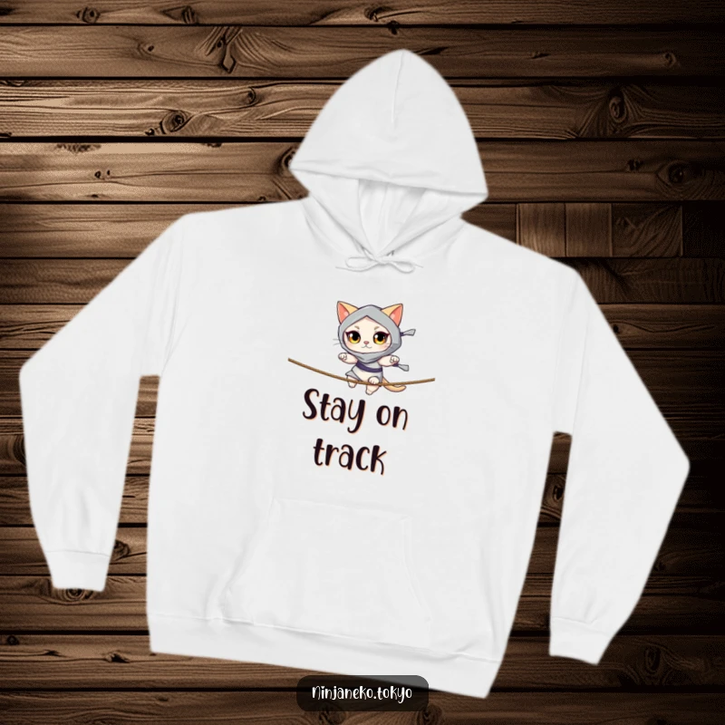 Funny hoodie depicting a ninja cat with bright eyes balancing on a thin rope, offering warmth and a humorous design. Great funny gift.