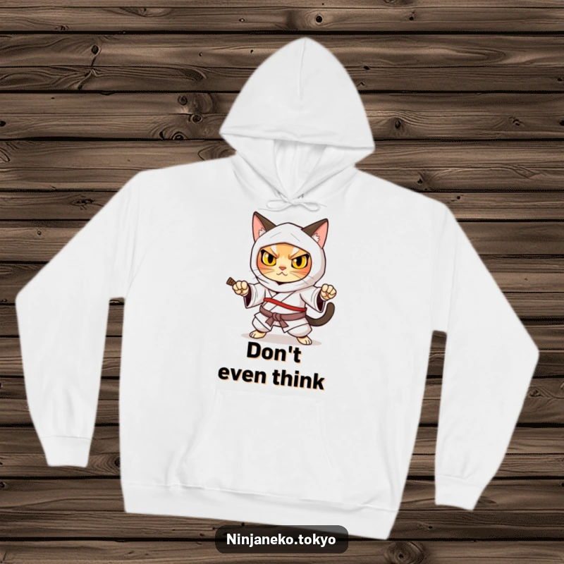 Funny ninja cat in a traditional kimono adopting a powerful defensive stance, conveying strength on this warm hoodie.