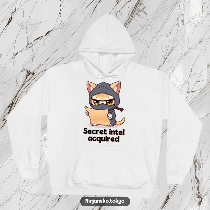 Funny hoodie featuring a masked ninja cat intently studying a scroll, offering warmth and a touch of mystery. Cozy and contemplative.