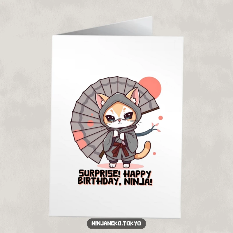 Funny Free Printable Birthday Card: A ninja cat in a kimono peeks playfully from behind a large, decorative Japanese fan.
