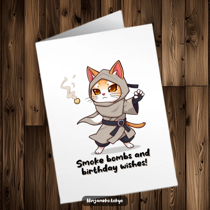 Funny Free Printable Ninja Cat Birthday Card: A ninja cat in a flowing kimono prepares to throw a smoking pellet, adding mystery.