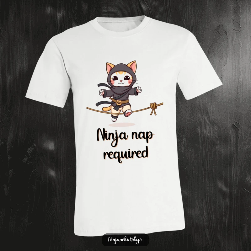 Funny t-shirt showcasing a stealthy ninja cat attempting to walk a tightrope, demonstrating skill and a touch of silliness.