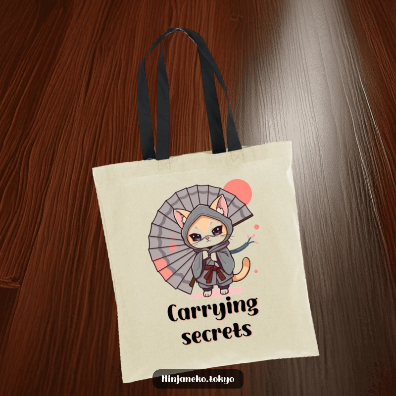 Funny Tote Bag: A ninja cat in a kimono playfully hides behind a large Japanese fan, adding a touch of mysterious humor.